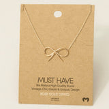 Gold Dipped Bow Tie Pendant Necklace: G